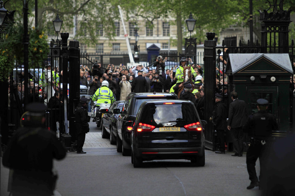 The motorcade carrying Britain's former Prime Minister Gordon Brown, leaves his former official residence at 10 Downing Street in central London, on May 11, 2010. (AP Photo/Lefteris Pitarakis)