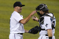 Miami Marlins relief pitcher Brandon Kintzler, left and catcher Chad Wallach celebrate after a baseball game against the Philadelphia Phillies, Monday, Sept. 14, 2020, in Miami. (AP Photo/Lynne Sladky)