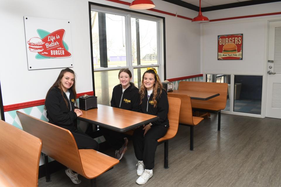 LSUA cheerleaders Bethany Bonnette, Kylie Callegari and Sheridan Black visited the school's newest dining option, Burger 318, just to see what it was like. They all loved the retro theme.