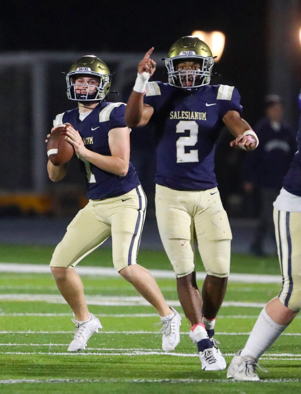 Salesianum quarterback Ryan Stoehr looks to his receiver as running back B.J. Alleyne gestures on a scoring play in the fourth quarter of the Sals' 37-14 victory over Middletown on Friday night at Abessinio Stadium.