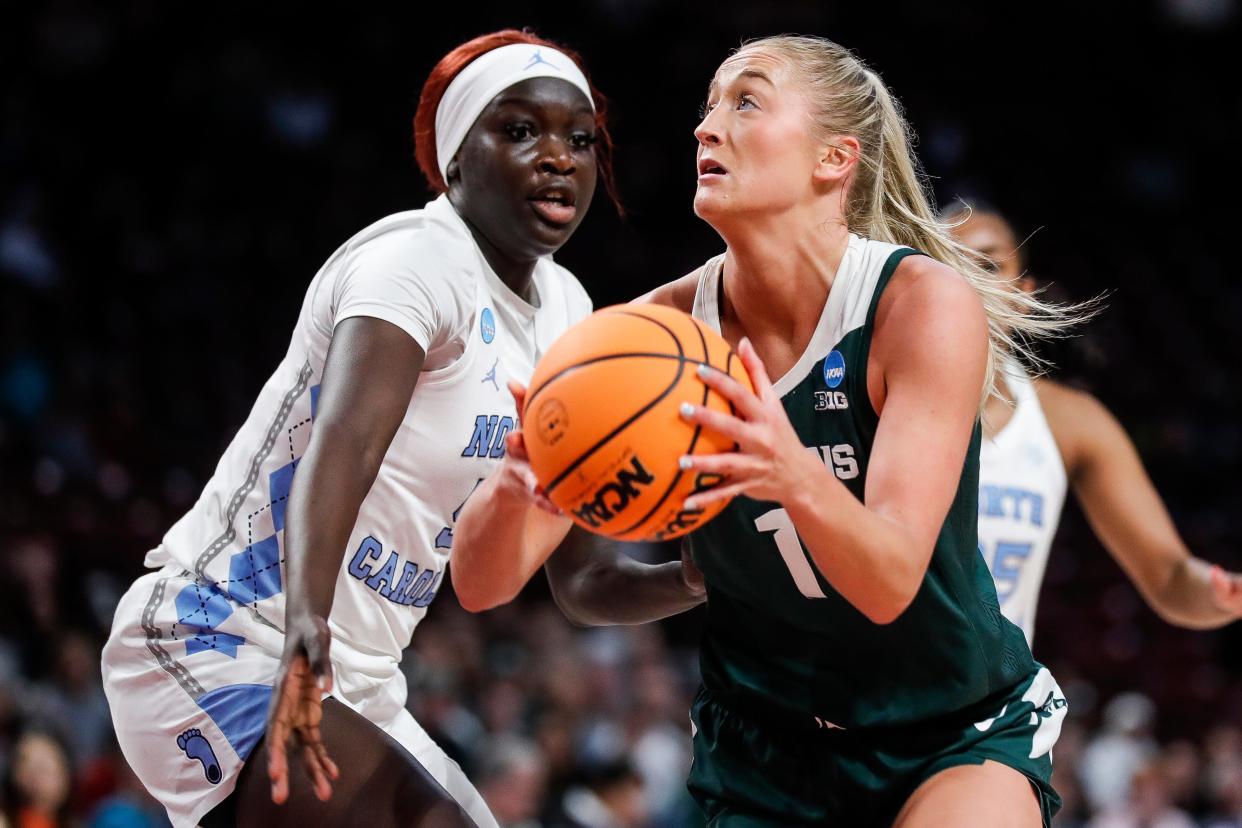 Michigan State guard Tory Ozment (1) goes to the basket against North Carolina forward Maria Gakdeng (5) during the first half of NCAA tournament first round at Colonial Life Arena in Columbia, S.C. on Friday, March 22, 2024.