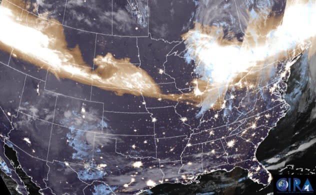 In this polar-orbiting satellite view, the city lights of major towns are seen with aurora (brown to white) over the Midwest and Northeast on Friday, May 10, 2024. (NOAA/CIRA)