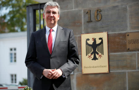 FILE PHOTO - Andreas Mundt, president of Germany's Federal Cartel Office, poses for a photo in front of their office in Bonn, Germany April 17, 2018. REUTERS/Wolfgang Rattay