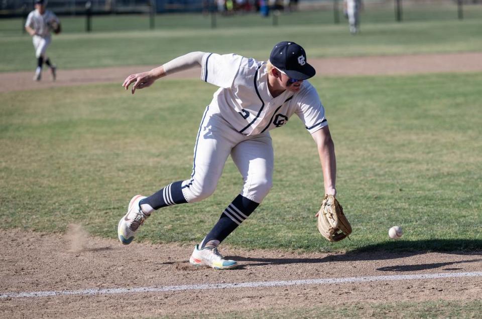 Central Catholic’s Seth Van Dyk backhands a ground ball during the Division III Sac-Joaquin Section playoff game with Christian Brothers at Central Catholic High School in Modesto, Calif., Wednesday, May 17, 2023. The Raiders won the game 8-1.