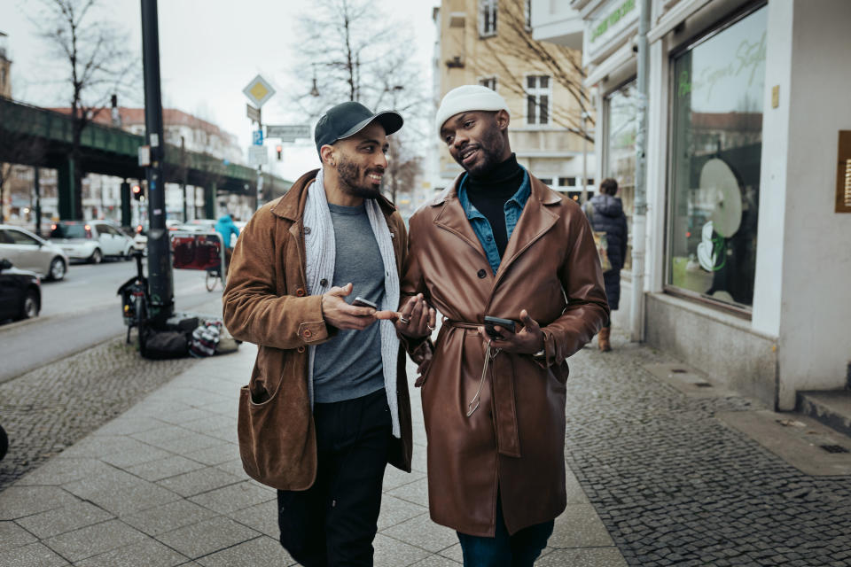 Two people talking on the street