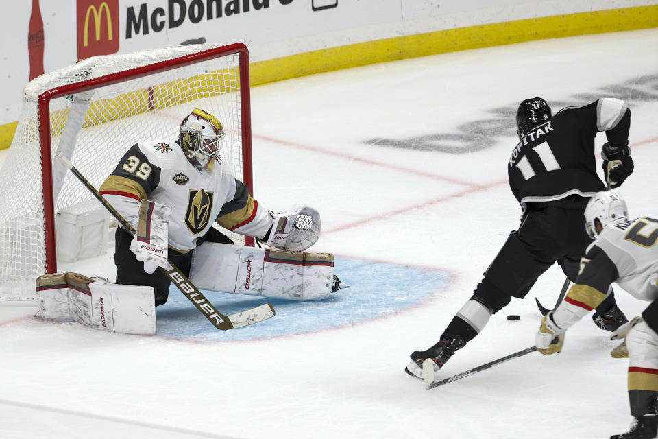 Los Angeles Kings forward Anze Kopitar (11) gets ready to shoot on Vegas Golden Knights goalie Laurent Brossoit (39) for his third goal of the night, during the third period of an NHL hockey game Thursday, Oct. 14, 2021, in Los Angeles. The Kings won 6-2. (AP Photo/Ringo H.W. Chiu)