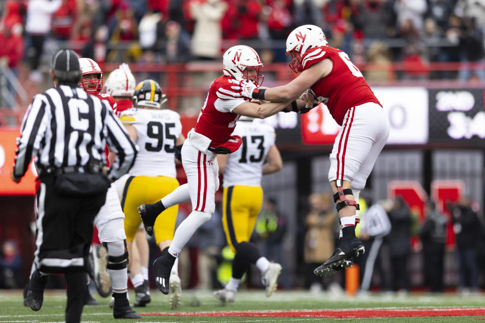 Nebraska quarterback Chubba Purdy, left, celebrates with Ben Scott after throwing a 56-yard touchdown pass during the first half of an NCAA college football game Friday, Nov. 24, 2023, in Lincoln, Neb. (AP Photo/Rebecca S. Gratz)