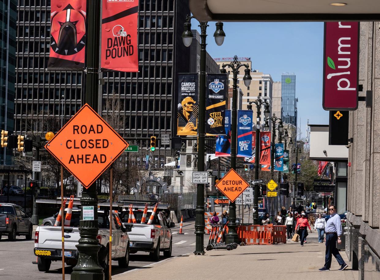 Banners for NFL teams line Woodward Avenue as work continues on the setup for the upcoming NFL draft near Campus Martius in downtown Detroit on Tuesday, April 16, 2024.