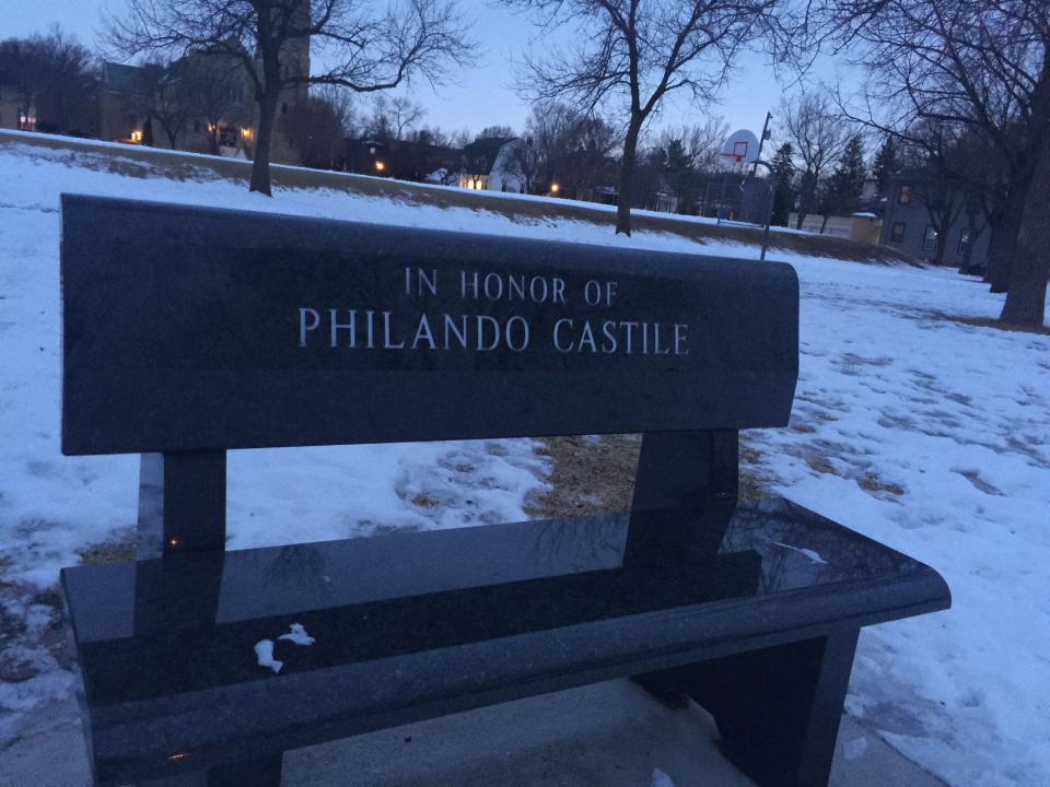 There is a bench memorial outside the school where Philando Castile worked. (Yahoo Sports)