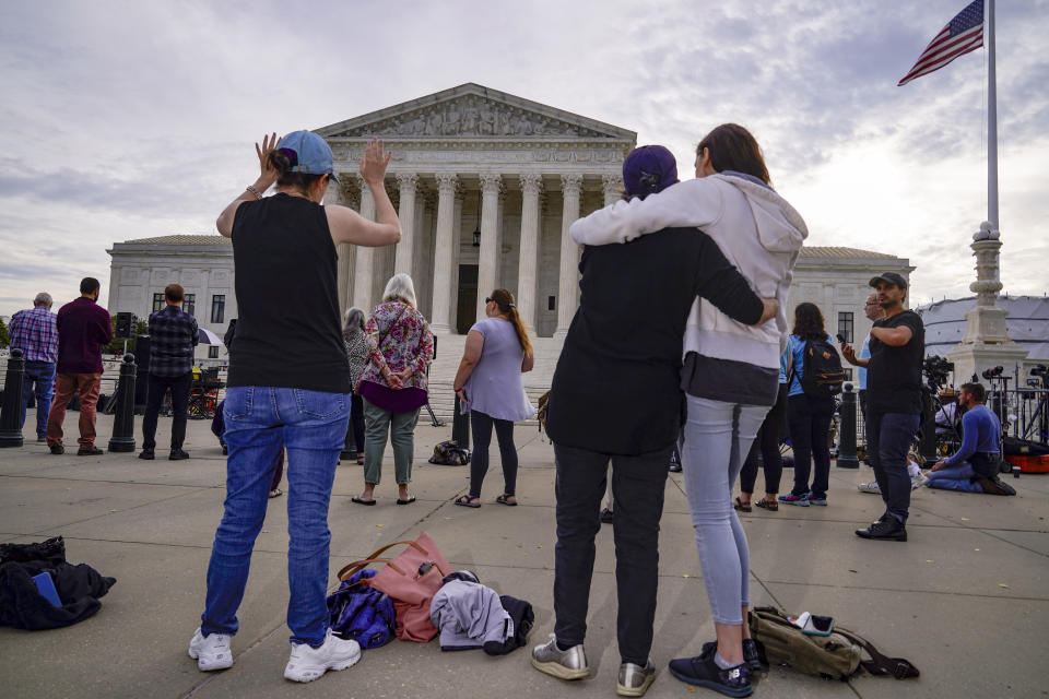 The Supreme Court is seen on the first day of the new term as activists opposed to abortion demonstrate on the plaza, in Washington, Monday, Oct. 4, 2021. Arguments are planned for December challenging Roe v. Wade and Planned Parenthood v. Casey, the Supreme Court's major decisions over the last half-century that guarantee a woman's right to an abortion nationwide. (AP Photo/J. Scott Applewhite)