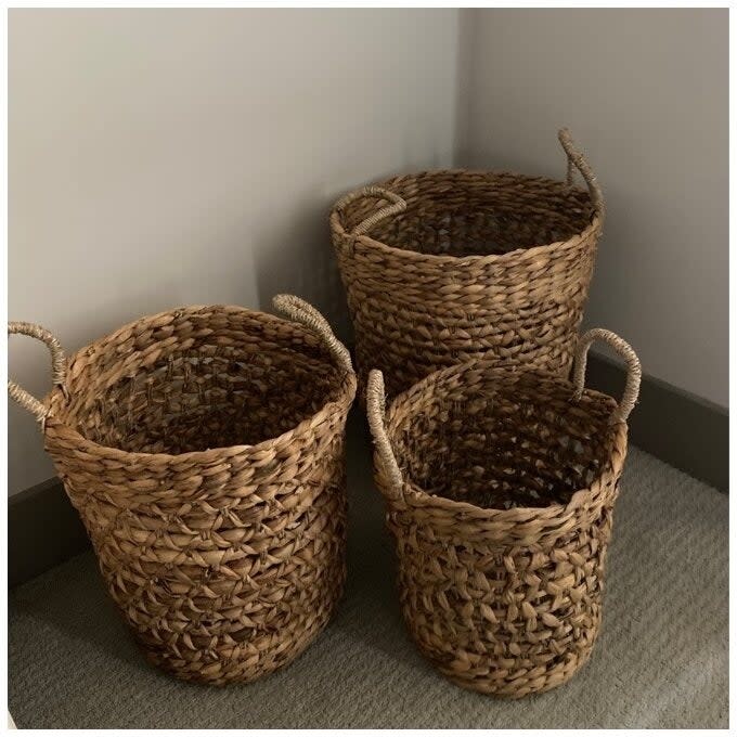 a reviewer photo of the three storage baskets