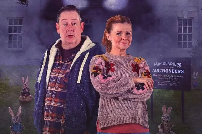 Johnny Vegas and Sian Gibson stood side-by-side outside a burning auctioneer's in Murder They Hope