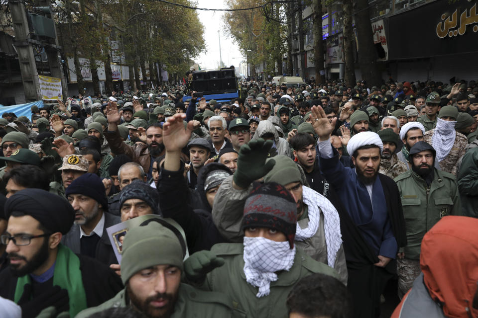 Mourners attend a funeral procession of Revolutionary Guard member Morteza Ebrahimi, who was killed during recent protests, in the town of Shahriar, Iran, some 40 kilometers (25 miles) southwest of the capital, Tehran, Wednesday, Nov. 20, 2019. Ebrahimi was killed during protests over government-set fuel prices rising last week, demonstrations that quickly spiraled in violence. (AP Photo/Vahid Salemi)