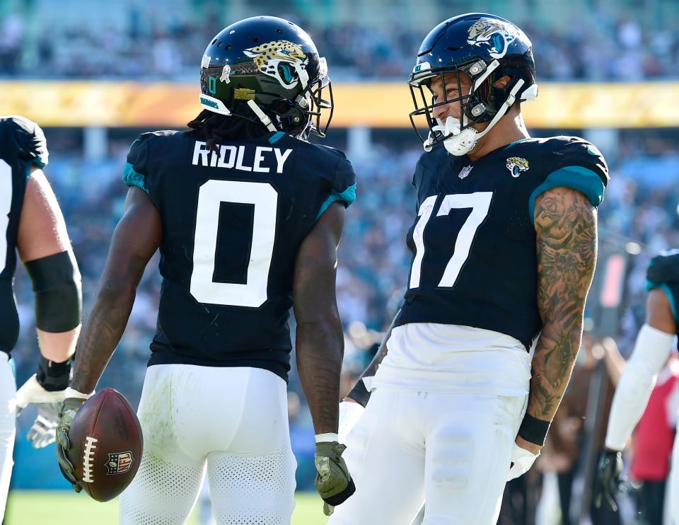 Jacksonville Jaguars tight end Evan Engram (17) celebrates with wide receiver Calvin Ridley (0) after Ridley's late third quarter touchdown catch. The Jacksonville Jaguars hosted the Tennessee Titans at EverBank Stadium in Jacksonville, FL Sunday, November 19, 2023. The Jaguars led 13 to 0 at the half and walked away with a 34 to 14 win over the Titans. [Bob Self/Florida Times-Union]