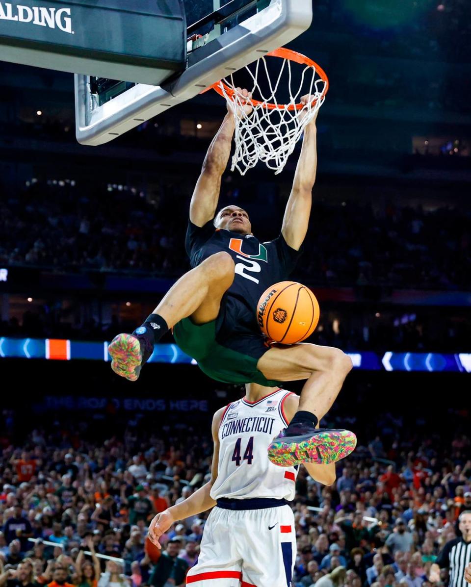 Miami Hurricanes guard Isaiah Wong (2) dunks against Connecticut Huskies guard Andre Jackson Jr. (44) during the second half of the Men’s Basketball Championship National Semifinal at NRG Stadium in Houston, Texas on Saturday, April 1, 2023.