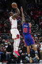 Chicago Bulls forward DeMar DeRozan, left, shoots over Detroit Pistons guard Cory Joseph during the first half of an NBA basketball game in Chicago, Saturday, Oct. 23, 2021. (AP Photo/Nam Y. Huh)