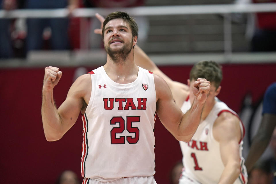 Utah guard Rollie Worster (25) celebrates after scoring against Arizona during the first half of an NCAA college basketball game Thursday, Dec. 1, 2022, in Salt Lake City. (AP Photo/Rick Bowmer)