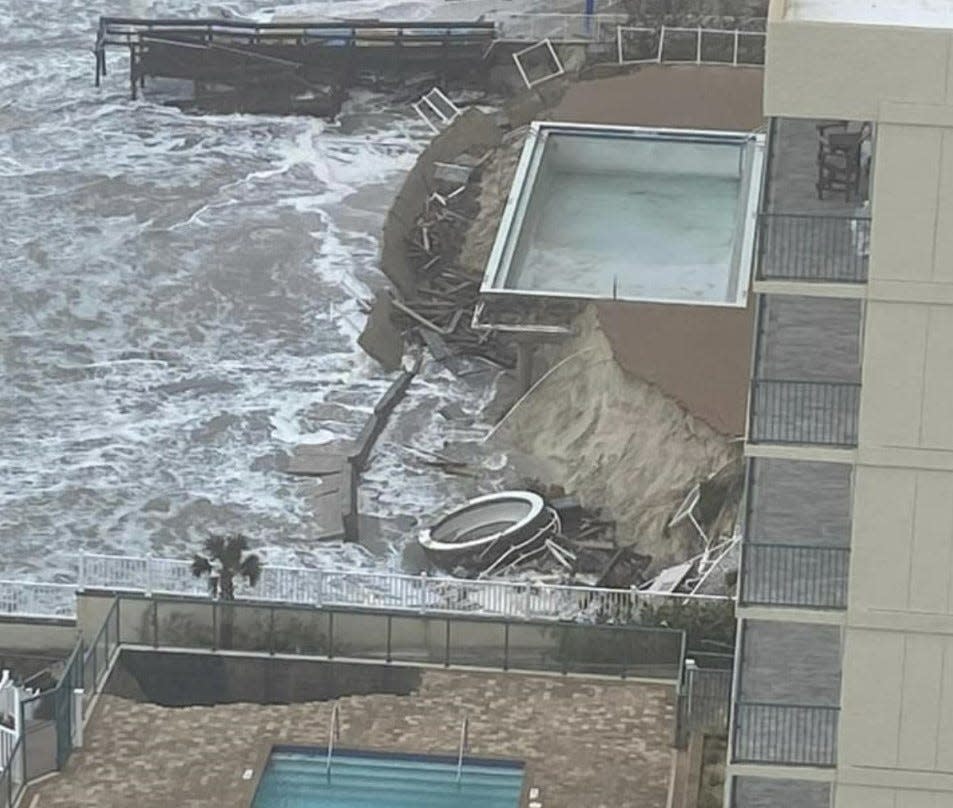 Daytona Beach Shores resident Donna Reeves Fremont took this photo of heavy waves crashing against two neighboring oceanfront condos whose pool decks were damaged during Tropical Storm Nicole earlier in the morning on Thursday, Nov. 10, 2022. Fremont lives in The Ashley Condominium complex two doors north of the Dimucci Tower whose pool area is in the foreground, and the collapsing pool deck for the Sanibel condos.