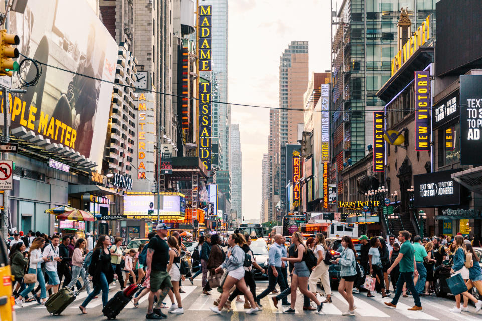 Crowds of people crossing street on zebra crossing in New York, USA. PHOTO: Getty