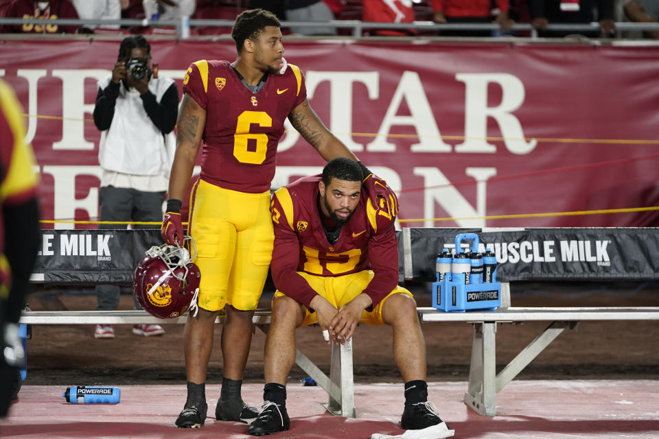 Southern California quarterback Caleb Williams, right, reacts with running back Austin Jones after the team's loss to Utah in an NCAA college football game, Saturday, Oct. 21, 2023, in Los Angeles. (AP Photo/Ryan Sun)