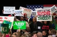 Protestors take over the stage forcing Democratic presidential hopeful Minnesota Senator Amy Klobuchar to cancel her rally before it even started on March 1, 2020 in St. Louis Park, west of Minneapolis, Minnesota. - Hundreds of Klobuchar supporters witnessed a group of Black Lives Matter protesters demanding her to drop out of the race after her misshandling of Myon Burrell's case in 2002 when she was County Attorney. (Photo by Kerem Yucel / AFP) (Photo by KEREM YUCEL/AFP via Getty Images)