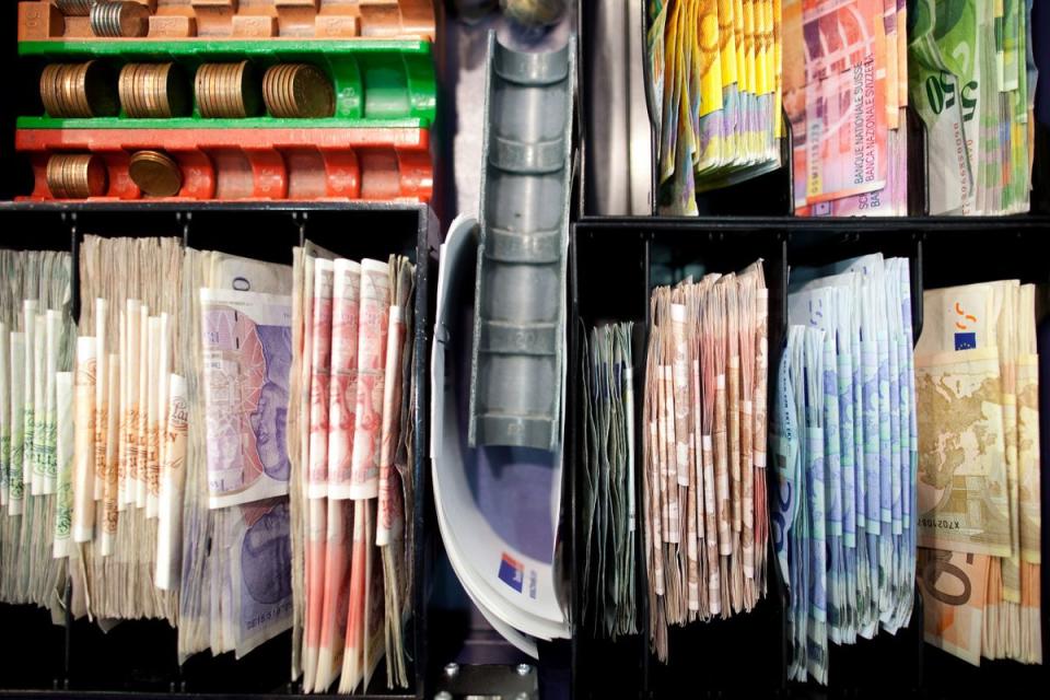 Mixed denomination currency banknotes in a cash register at a Travelex store, operated by Apax Partners LLP, at City airport in London, U.K.. (Photographer: Simon Dawson)