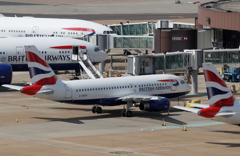 FILE PHOTO: British Airways aircraft are parked at the South Terminal at Gatwick Airport, in Crawley