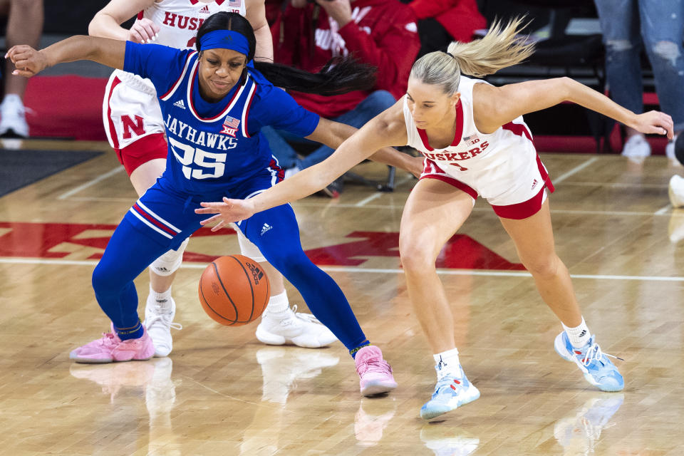 Kansas' Chandler Prater has the ball stolen away by Nebraska's Jaz Shelley during the first half of an NCAA college basketball game Wednesday, Dec. 21, 2022, in Lincoln, Neb. (Kenneth Ferriera/Lincoln Journal Star via AP)