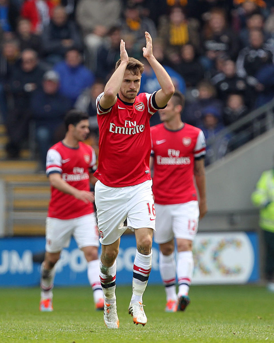 Arsenal's Aaron Ramsey celebrates scoring his side's first goal during their English Premier League soccer match against Hull City at The KC Stadium, Hull, England, Sunday, April 20, 2014. (AP Photo/Lynne Cameron, PA Wire) UNITED KINGDOM OUT - NO SALES - NO ARCHIVES