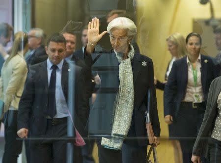 International Monetary Fund (IMF) head Christine Largarde waves as she arrives for talks at EU headquarters before a summit of euro zone government heads in Brussels, Belgium, June 22, 2015. REUTERS/Olivier Hoslet/Pool