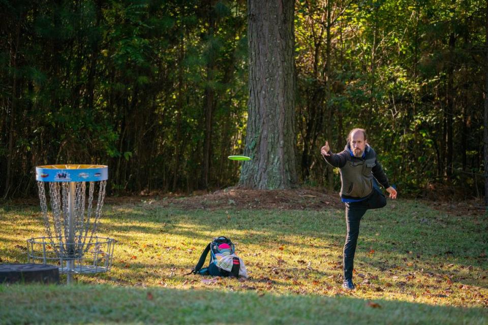 Professional disc golfer Michael Johansen puts on the green of Hole 6 at Hornet’s Nest Park.