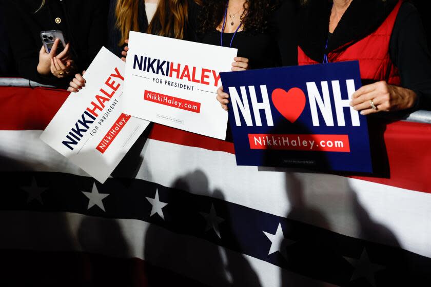 CONCORD, NH - JANUARY 23: Nikki Haley supporters holds signs during the Nikki Haley New Hampshire primary watch party at Grappone Conference Center on Tuesday, Jan. 23, 2024 in Concord, NH. (Gina Ferazzi / Los Angeles Times)