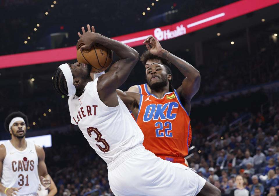 Nov 8, 2023; Oklahoma City, Oklahoma, USA; Oklahoma City Thunder guard Cason Wallace (22) defends a shot by Cleveland Cavaliers guard Caris LeVert (3) during the second quarter at Paycom Center. Mandatory Credit: Alonzo Adams-USA TODAY Sports