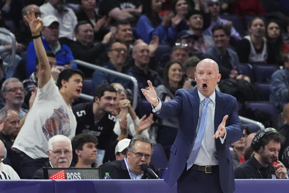 Maryland coach Kevin Willard, right, reacts after Northwestern guard Ty Berry made a 3-point basket during the second half of an NCAA college basketball game in Evanston, Ill., Wednesday, Jan. 17, 2024. (AP Photo/Nam Y. Huh)