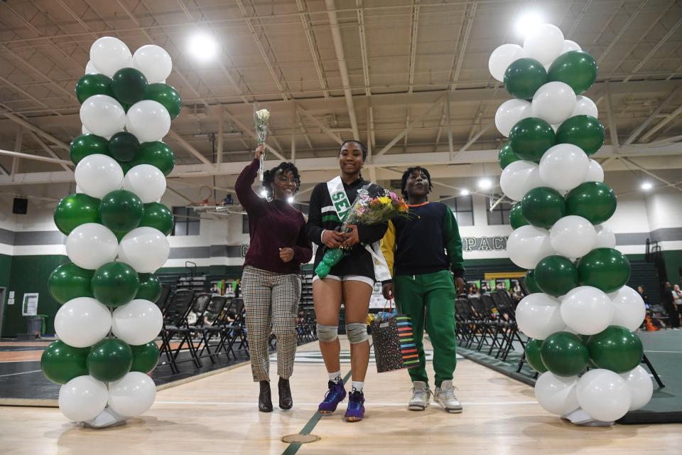 Greenbrier senior Arieana Bacon celebrates with her family on senior night during a girls wrestling meet at Greenbrier Middle School on Friday, Jan. 12, 2024.
