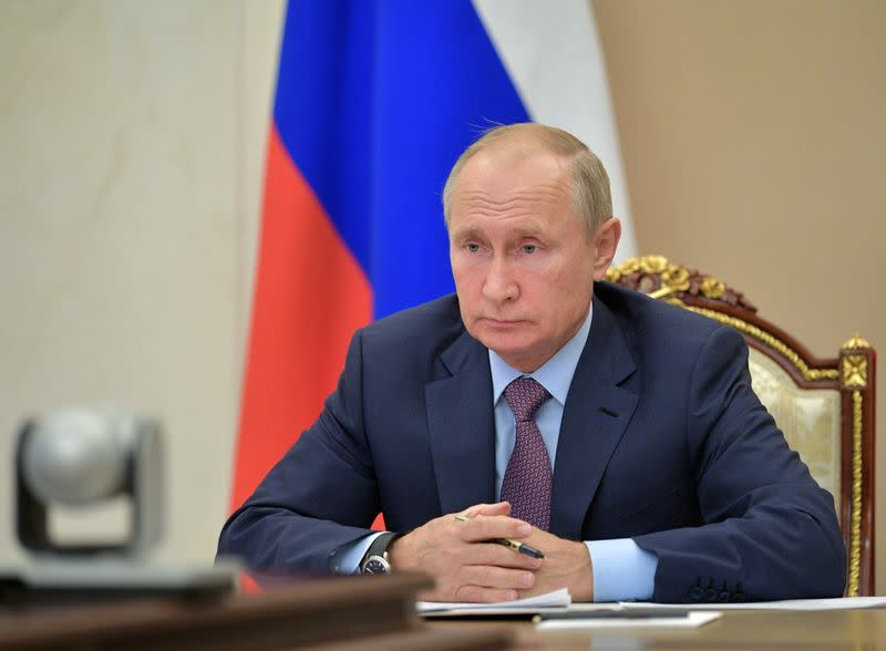 FILE PHOTO: Russian President Putin chairs a meeting via video link outside Moscow