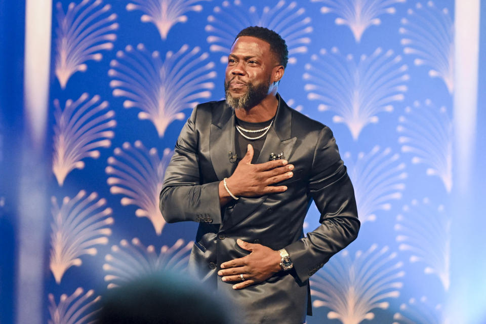 Honoree US actor comedian Kevin Hart acknowledges applause on stage during the 25th Annual Mark Twain Prize For American Humor at the John F. Kennedy Center for the Performing Arts in Washington, DC, on March 24, 2024. This year's award, which is named to honor one of the world's greatest humorists, honors US actor and comedian Kevin Hart. (Photo by ROBERTO SCHMIDT / AFP) (Photo by ROBERTO SCHMIDT/AFP via Getty Images)