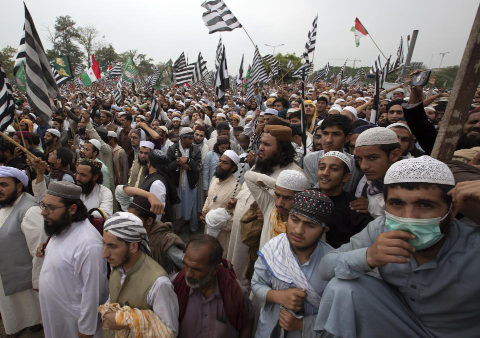 Supporters of a Pakistani radical Islamist party 'Jamiat Ulema-e-Islam', attend an anti-government march, in Islamabad, Pakistan, Friday, Nov. 1, 2019. Thousands of members of a radical Islamist party have camped out in Pakistan's capital, demanding the resignation of Prime Minister Imran Khan over economic hardships. (AP Photo/B.K. Bangash)