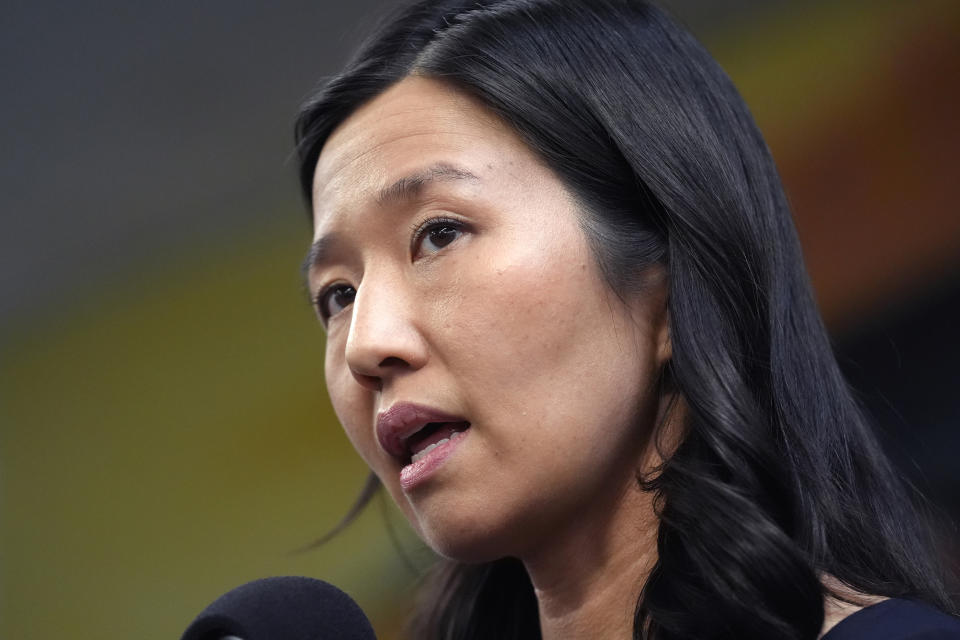 Boston Mayor Michelle Wu takes questions from reporters Wednesday, Jan. 31, 2024, after touring the Cass Recreational Complex, in the Roxbury neighborhood of Boston. The visit to the facility was held ahead of its planned opening as a temporary shelter site for families experiencing homelessness as the state continues to grapple with an influx of homeless migrants. (AP Photo/Steven Senne)