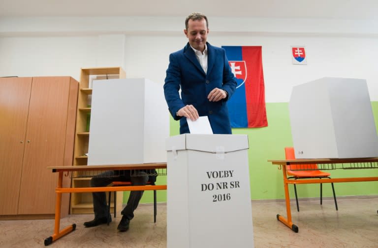 Radoslav Prochazka, leader of the political party SIET, casts his vote during the general elections in Trnava, Slovakia, on March 5, 2016