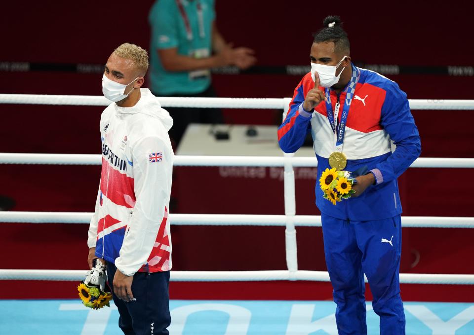 Ben Whittaker and Cuba’s Arlen Lopez on the podium after the Olympic final bout (Mike Egerton/PA) (PA Wire)