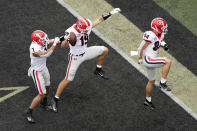 Georgia tight end Brock Bowers (19) celebrates with Jermaine Burton (7) and Ladd McConkey (84) after Bowers scored his second touchdown of the game against Vanderbilt in the first half of an NCAA college football game Saturday, Sept. 25, 2021, in Nashville, Tenn. (AP Photo/Mark Humphrey)