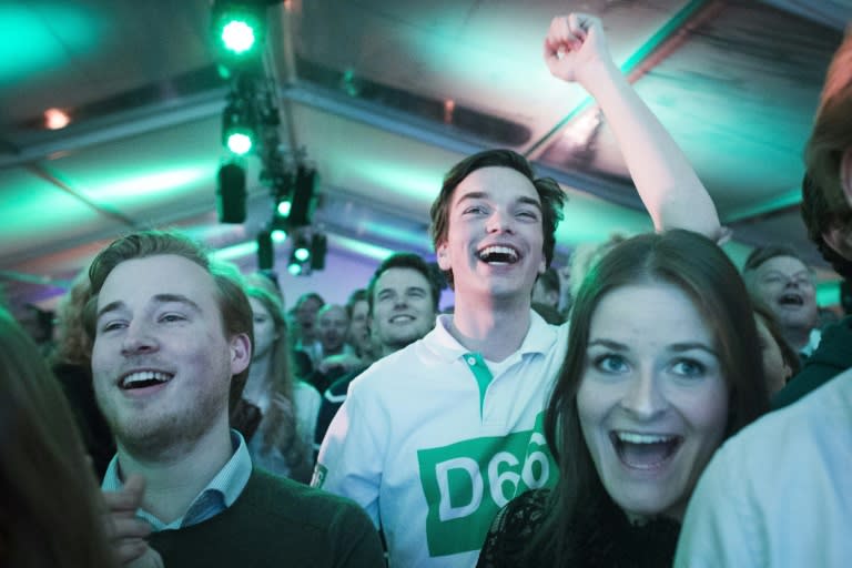 Militants of the Dutch Democracy party D66 celebrate during an election rally in Scheveningen, on March 15, 2017