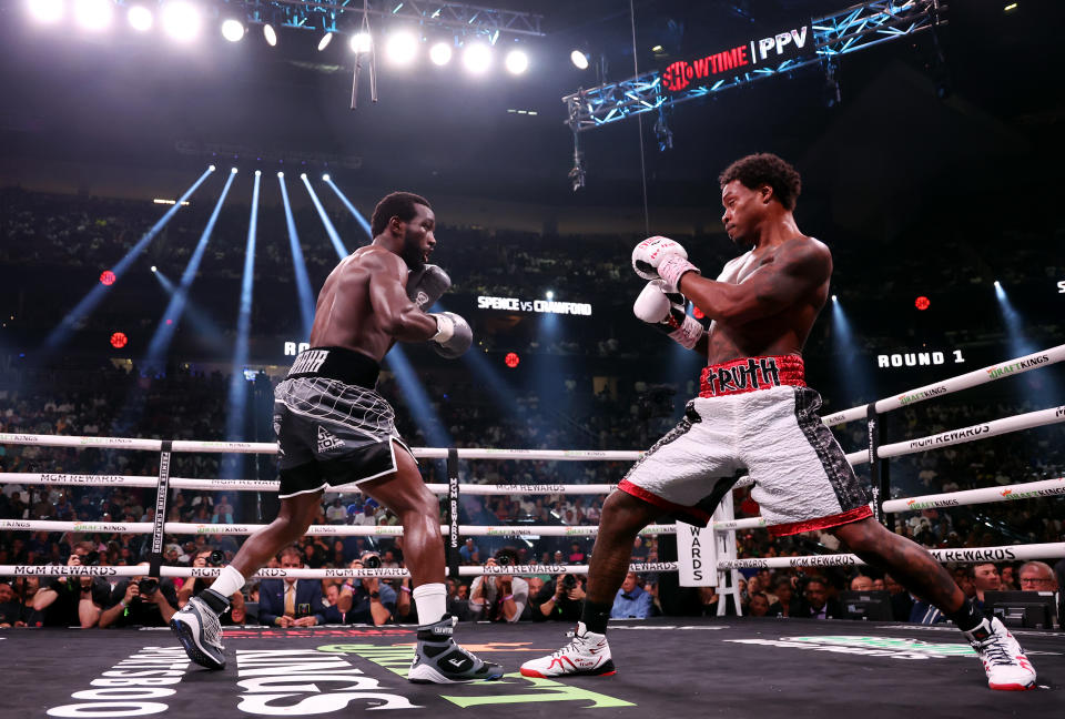 LAS VEGAS, NEVADA - JULY 29: Terrence Crawford and Errol Spence Jr. exchange punches during round 1 of the World Welterweight Championship bout at T-Mobile Arena on July 29, 2023 in Las Vegas, Nevada. (Photo by Al Bello/Getty Images)