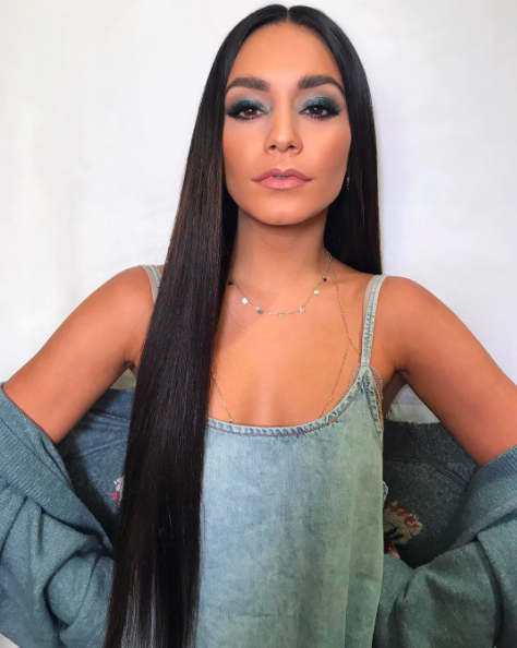 <p>Hudgens looked like a younger version of Cher with her superlong and superstraight strands. We love how she matched her cool blue eye makeup to her denim outfit. (Photo: Vanessa Hudgens via Instagram) </p>