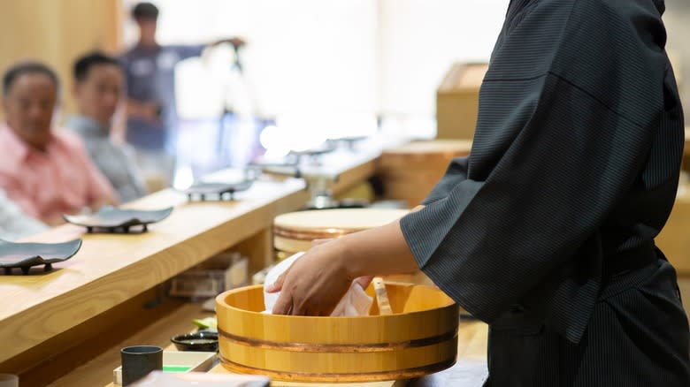 Omakase chef preparing rice