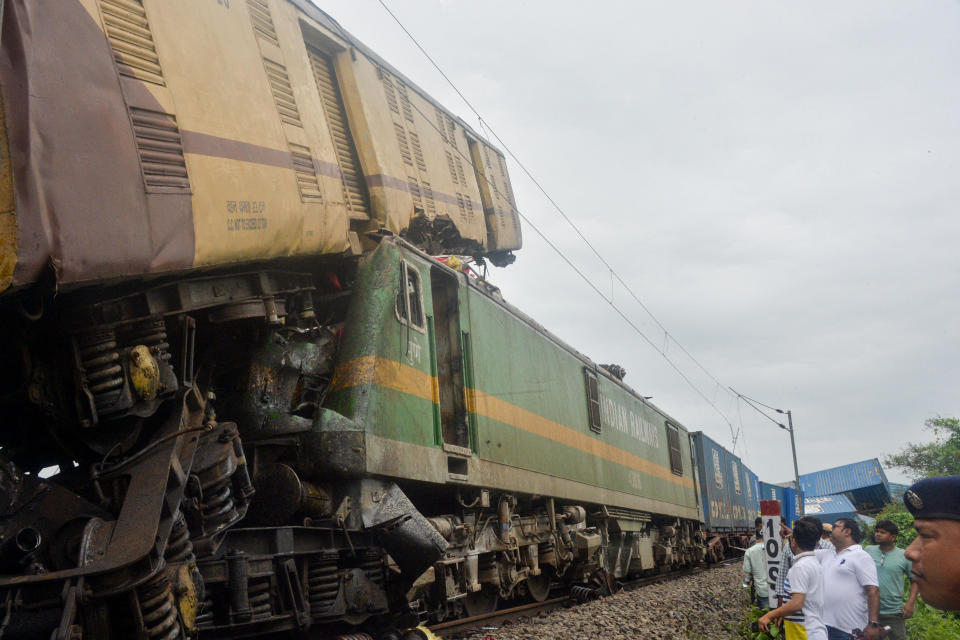 People gather near the site of a collision between a passenger train and a freight train in Nirmaljote, near Rangapani station in India's West Bengal state, June 17, 2024. / Credit: DIPTENDU DUTTA/AFP/Getty