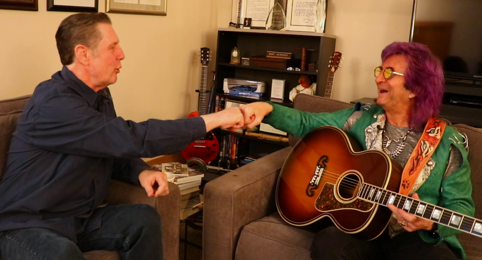 Bart Herbison, left, fist-bumps Jim Peterik.