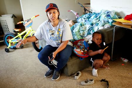 A'Kendra Erving speaks to a reporter in her home with her son, King Erving, 3, in East Chicago, Indiana, U.S. September 16, 2016. REUTERS/Michelle Kanaar