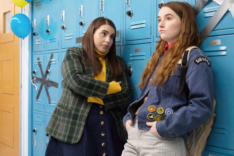 Beanie Feldstein and Kaitlyn Dever talking at their lockers.